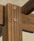 Close-up of Carbonized Wood Garden Arbor for Outdoor Weddings showing solid fir wood frame with metal bolts