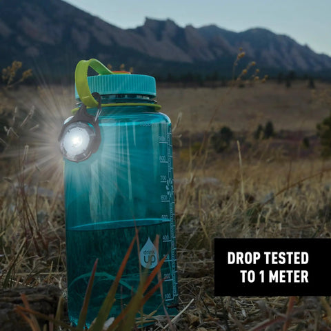 Moonlit Rechargeable Micro Lantern for Camping and Hiking clipped to water bottle in outdoor setting