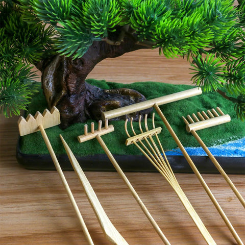 Mini Zen Garden Rake Stamp Set For Desk Stress Relief And Focus Dope Rock Sand Garden Accessories displayed with bamboo tools and figurines.