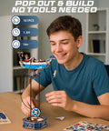 Teen assembling 3D Wooden Puzzle Kit For Adults Featuring Gravity Swing Ship Model And Aircraft Model.