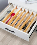 Premium Expandable Bamboo Drawer Dividers Six Pack in a kitchen drawer organizing utensils, expanding from 16 to 22 inches.