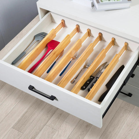 Premium Expandable Bamboo Drawer Dividers Six Pack in a kitchen drawer organizing utensils, expanding from 16 to 22 inches.