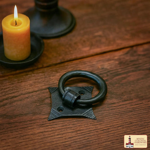 Mystic Colonial Cast Iron Ring Pull Handles With Screw Blackened Hammered Finish Antique Cabinet Hardware on wood surface