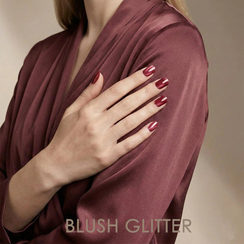 Close-up of hands with Semi Cured Gel Nail Strips Real Gel Polish UV Wraps For Brittle Nails, glitter cat eye hot pink.