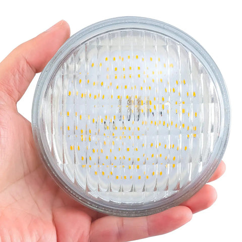 Hand holding Rugged Waterproof PAR36 LED Landscape Bulb Kit 9W 900LM 3000K Warm White 12V AC DC 4 Pack For Driveways Yards Off Road RVs