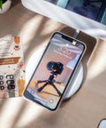 Slick Little Webcam Cover Slide For Laptops And Macbooks Featuring Adorable Cat Vibes on phone with tripod camera.
