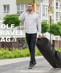 Man walking with Heavy Duty Golf Travel Bag With Wheels Soft Sided Golf Club Cover Made From 600D Polyester on sidewalk.