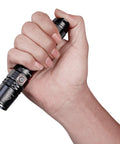 Hand holding PD35 V2.0 Flashlight With Cree XP-L HI V3 LED Up To 1000 Lumens And 250 Meter Throw Tail Switch Tactical EDC Light