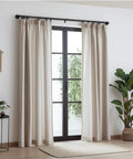 Heavy Duty 1 Inch Industrial Wrap Around Curtain Rod In Black, Adjustable 32 To 48 Inches, in a modern living room setting.