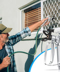 Man using Heavy Duty Airless Paint Spray Gun 3 Pack With 513 515 519 Tips for exterior window painting.