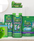 Green Gobbler cleaning products including drain sticks, dissolver, and septic saver pods displayed on a counter.