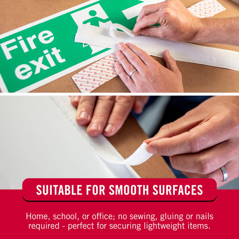 Hands applying 5 Ft White Adhesive Hook And Loop Tape Roll Cut To Length on fire exit sign and smooth surface.