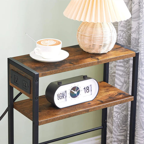 Slim Side Table With Charging Station And USB Ports For Small Spaces, narrow table with lamp and clock on rustic brown shelves.