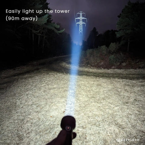 Rechargeable LED Flashlight With 2100 Lumen Output And 690 Meter Throw For Serious Long Range Illumination lighting up a tower
