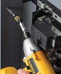 Pivoting Impact Driver Bit Tip Holder with ring in action on quarter inch shank, delivering 2000 inch pounds of torque, durable steel