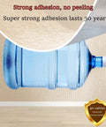 Six Millimeter Snap And Stay Wall Panels With Aluminum Foil Backing Moisture Resistant Thermal Insulation Wallpaper For Kitchen Vibe Check and Cozy Winter Refresh DIY Friendly Quick Fix, showing strong adhesion test with large water bottle.