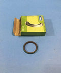 Oil seal ring beside green SKF box; brown rubber seal for radial shaft.