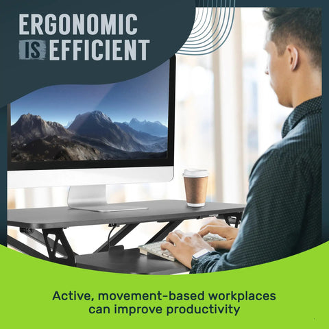Person using 32 Inch Adjustable Standing Desk Converter For Home Office Sit To Stand Desk Setup With Keyboard Tray And Dual Monitor Riser Black Height From 4.3 To 19.7 Inches