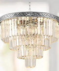 Crystal Chandelier Pendant Light 7 Light Modern Raindrop 4 Tier Silver Ceiling Fixture For Dining Room Living Room Bedroom Foyer Bathroom 110V E12 Bases Dimmable Bulbs Not Included Lit Look, shining with light against a blurred background.