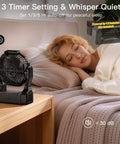 Battery Operated Fan For Camping And Outdoor Adventures 2 In 1 D Cell Battery And USB Powered Portable Fan next to sleeping person