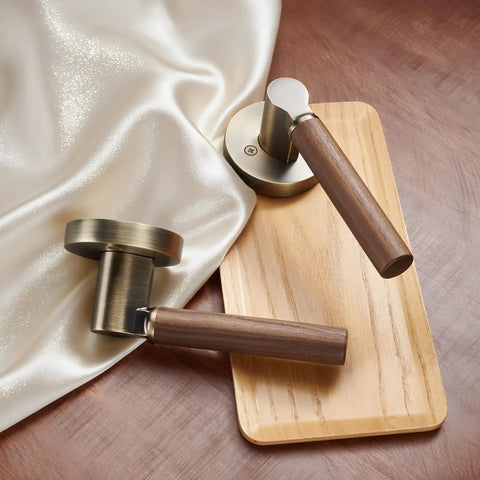 Walnut Wood Decorative Door Lever Two Pack With Antique Brass Finish Zinc Alloy Base Non Locking Dummy Handle For Interior Doors Warm Touch And Premium Cozy Vibe, two levers on display