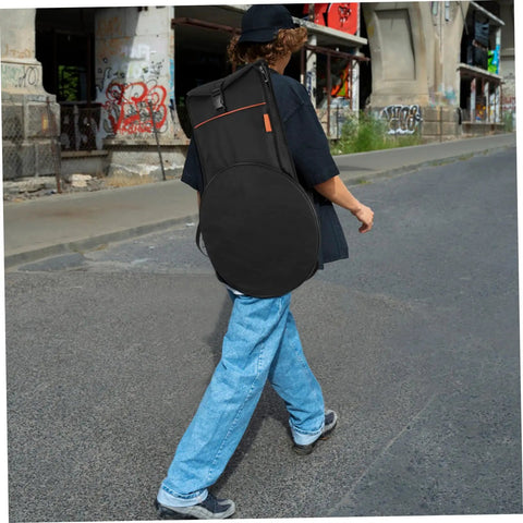 Person walking with a Heavy Duty 12 Inch Practice Pad Backpack That Stays Totes Waterproof securely carrying drum gear.