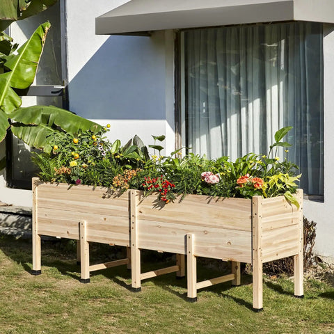 Side view of 7x2 Ft Raised Garden Bed With 16 Inch Depth And Legs, Drainage Holes, filled with flowers, on a patio