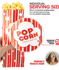 Hand holding Large 2 Oz Red And White Paper Popcorn Bags Bulk 100 Pack Disposable Grease Resistant Bags for snacks