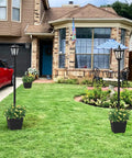64 Inch Outdoor Solar Lamp Post With Planter 60 Lumen Waterproof Garden Path Driveway Light For Yard Front Back Door No Fuss Easy Install Solar Post Light All Weather Ready, installed in a front yard beside a red car, showing greenery in the planters.