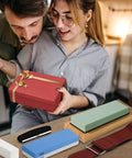 Couple opening gift with Pro Grade Double Sided Whetstone Knife Sharpening Kit includes leather strop and honing guide visible