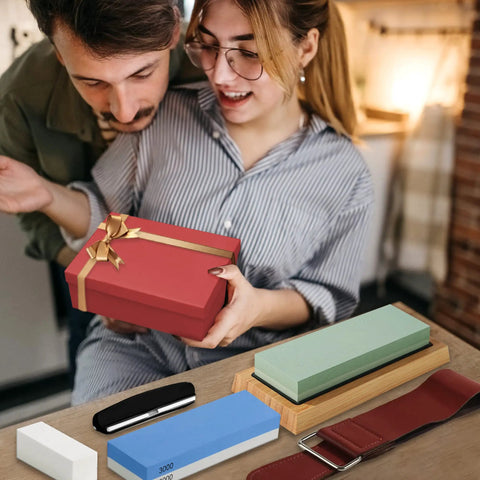 Couple opening gift with Pro Grade Double Sided Whetstone Knife Sharpening Kit includes leather strop and honing guide visible