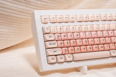 Close-up view of Clean 80 Percent Wireless Mechanical Keyboard In Soft Pink Creamy Build Featuring Jelly Moa Profile Transparent Keycaps.