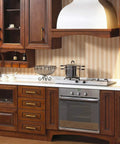 Gold And Black Cabinet Handles Pack Of 10 Slick Brushed Brass Look Drawer Pulls in a wooden kitchen setup.