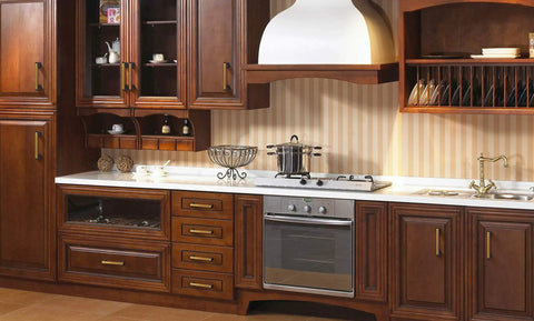 Gold And Black Cabinet Handles Pack Of 10 Slick Brushed Brass Look Drawer Pulls in a wooden kitchen setup.