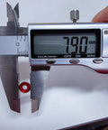 Measuring a red M3 counterbore washer with calipers at 7.90mm for Top Shelf 60 Pack M3 Counterbore Washers In Sweet Golden Anodized Aluminum Alloy Finish And Rock Solid Grip Perfect For Rc Drone Fpv Toys Mechanical Screw Sets No Sweat Assembly.