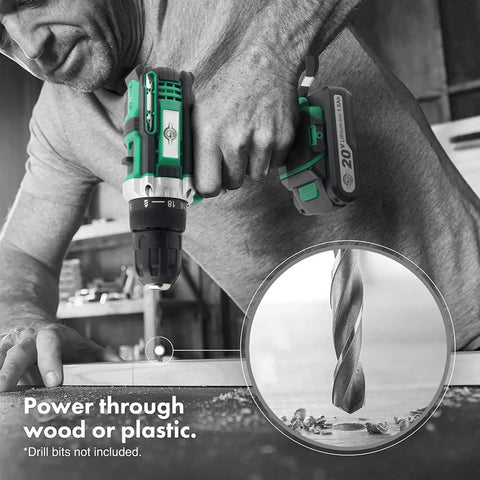 Man using green and black drill on wood surface