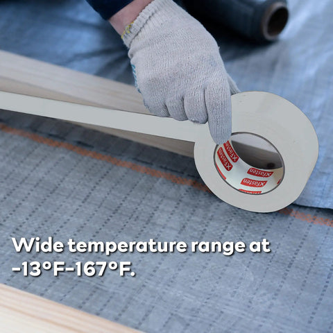 White Vapor Barrier Tape 9 Mil Thick, 3.78-Inch by 60-Yards Waterproof being applied on fabric with gloved hand