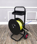 Top Shelf Banding Strapping Cart For Steel And Poly Strap Rolls, black metal frame with yellow strap reel and tool bin.