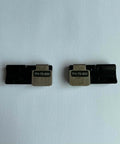 Two FH-70-900 Fiber Holder Fixture Jigs for FSM-70R 88R 90R Fusion Splicer, black, for 12-core ribbon clamps, front view.