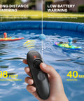 Dual RC Kayaks For Kids 6-12 With Magnetic Dolphin Nose And Three Balls, hand holding 2.4GHz remote for pool race fun