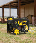 Beast 11500 Watt Dual Fuel Portable Generator with Electric Start for home backup, outdoors near a barn.
