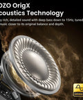 Close-up of earbud speaker detail with TOZO OrigX Acoustics Technology, highlighting deep bass capability.