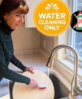 Person cleaning a pizza stone under running water with a brush, highlighted with 'Water Cleaning Only' symbol.