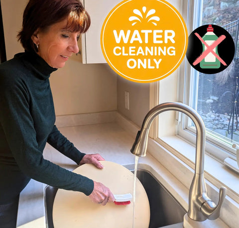 Person cleaning a pizza stone under running water with a brush, highlighted with 'Water Cleaning Only' symbol.
