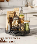 Smooth Spinning Nine Inch Solid Wood Lazy Susan Turntable with wide base holding spices on kitchen counter.