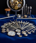 5 Piece Steel Watch Stem Crowns Kit For NH35 NH36 NH38 NH39 Movements Replacement Parts on a blue cloth