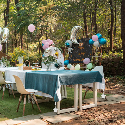 Outdoor picnic setup with 10 Pack Marble Tablecloth Weights With Clips, Heavy Duty Stainless Steel Pendant Stone Hangers
