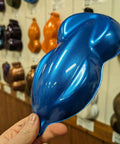 Top Shelf Automotive Basecoat In Rich Sapphire Steel Blue Metallic Shade One Full Gallon Gun Ready Mix With Slow Reducer shown on color sample.