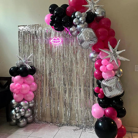 Hot Pink And Black Balloons Set 60 Count With Confetti as arch with silver stars, disco balls, in party setup indoors