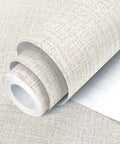 Close-up of Beige Grasscloth Peel And Stick Wallpaper For Cabinets Easy Install Self Adhesive Vinyl Wall Covering Faux Linen Texture 17.7In X 393.7In Roll Delivers Real Grasscloth Look Quick Renovation No Mess Durable And Lightweight, rolled with texture visible.